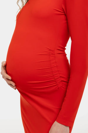 Μακρύ κόκκινο φόρεμα εγκυμοσύνης με σκίσιμο - - soonMAMA - Η σωστή προσθήκη στην κομψή και άνετη εγκυμοσύνη! - Παλτά για έγκυες