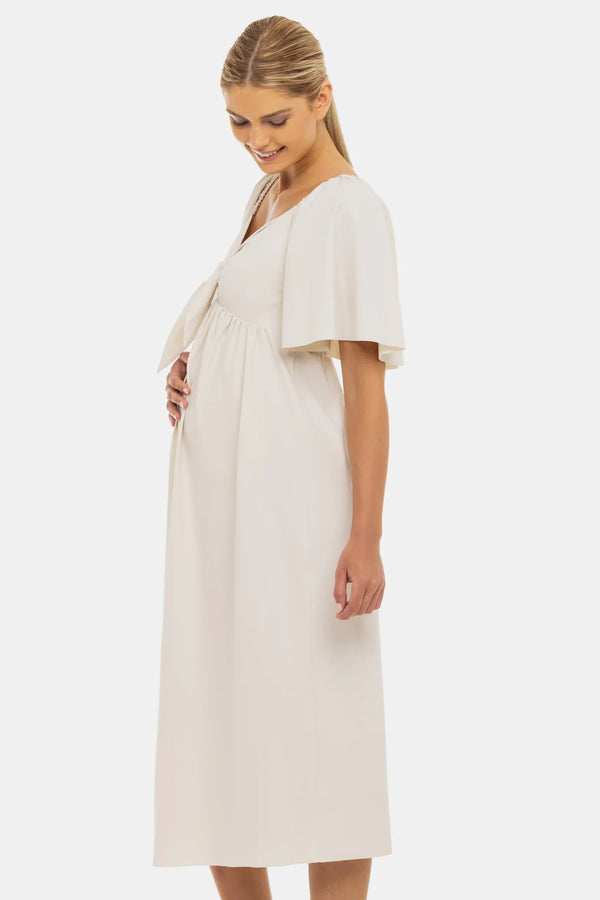 Φόρεμα εγκυμοσύνης με σούρες και φιόγκο – σε ανοιχτό μπεζ - - soonMAMA - Η σωστή προσθήκη στην κομψή και άνετη εγκυμοσύνη! - Παλτά για έγκυες