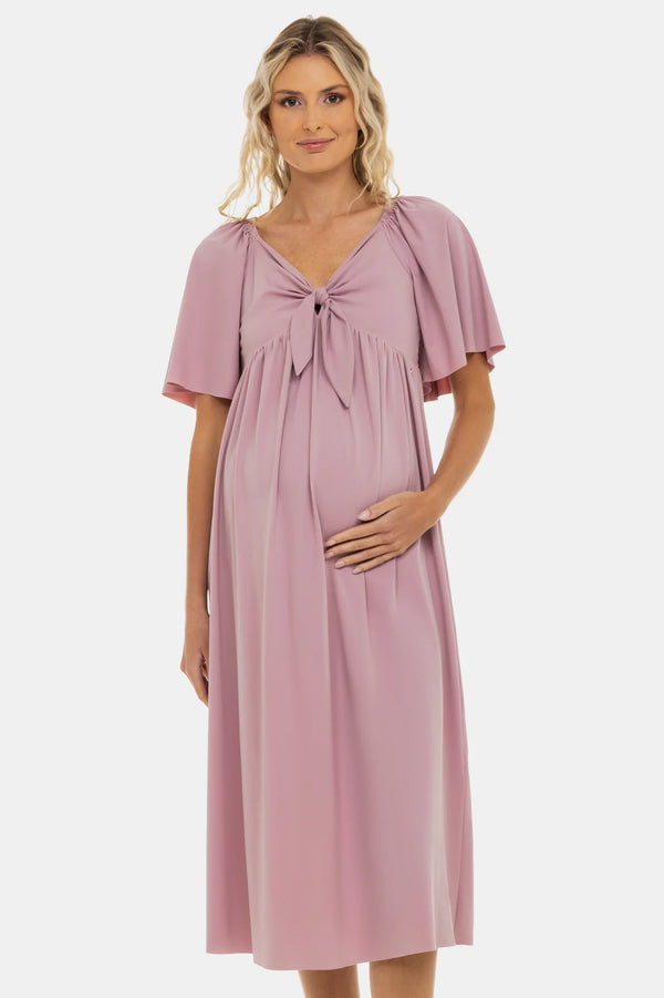 Φόρεμα εγκυμοσύνης με σούρες και φιόγκο – σε απόχρωση πούδρας - - soonMAMA - Η σωστή προσθήκη στην κομψή και άνετη εγκυμοσύνη! - Παλτά για έγκυες