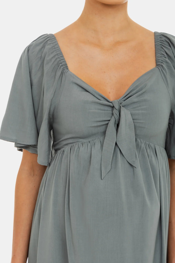 Καλοκαιρινό φόρεμα εγκυμοσύνης με σούρες στην πλάτη - - soonMAMA - Η σωστή προσθήκη στην κομψή και άνετη εγκυμοσύνη! - Παλτά για έγκυες