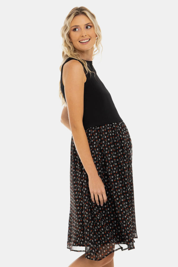 Κομψό φόρεμα με μαύρο βαμβακερό ριπ τοπ και αέρινη φούστα με λουλουδάτο μοτίβο